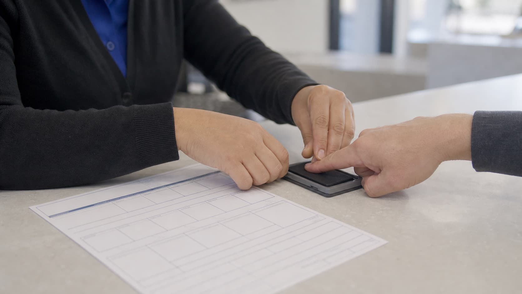 FD-258 ink fingerprint card preparation for a Redwood City resident